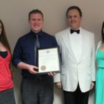Members of Escondido Elks Lodge 1687 posing proudly with an award.