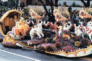 A float with horses and flowers on it.