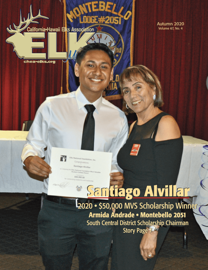 Young man holding certificate beside smiling woman, Elks