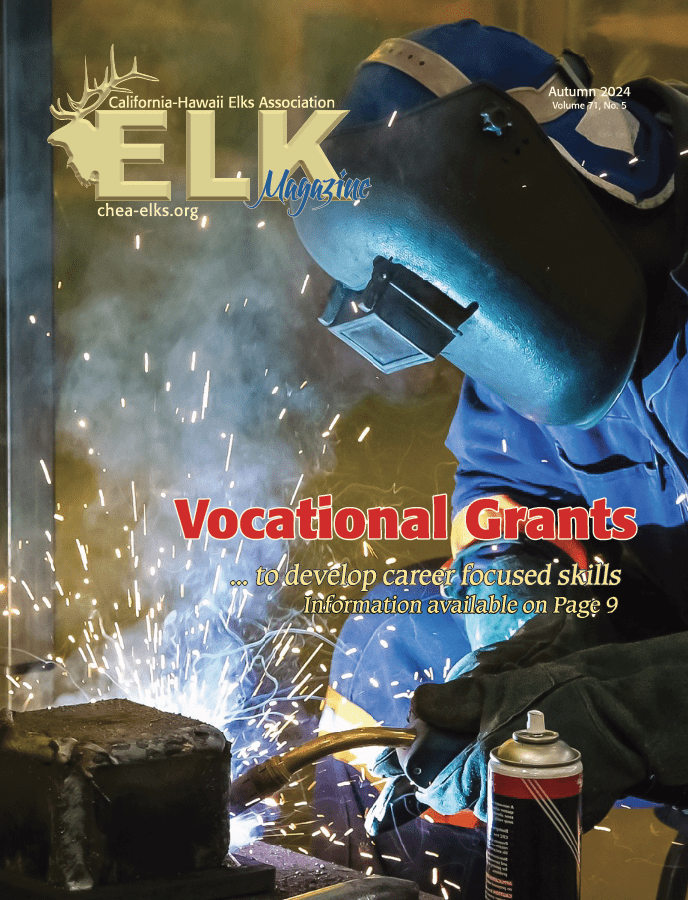 Magazine cover: welder welding with sparks
