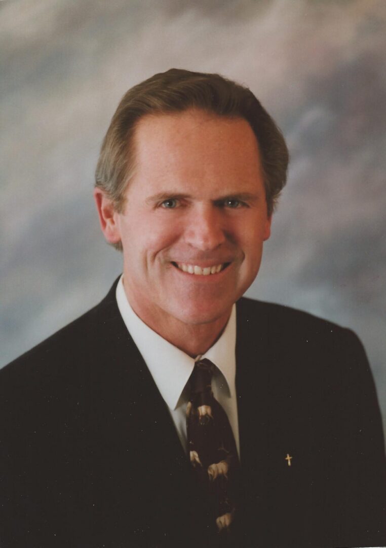 Smiling middle-aged man in suit and tie