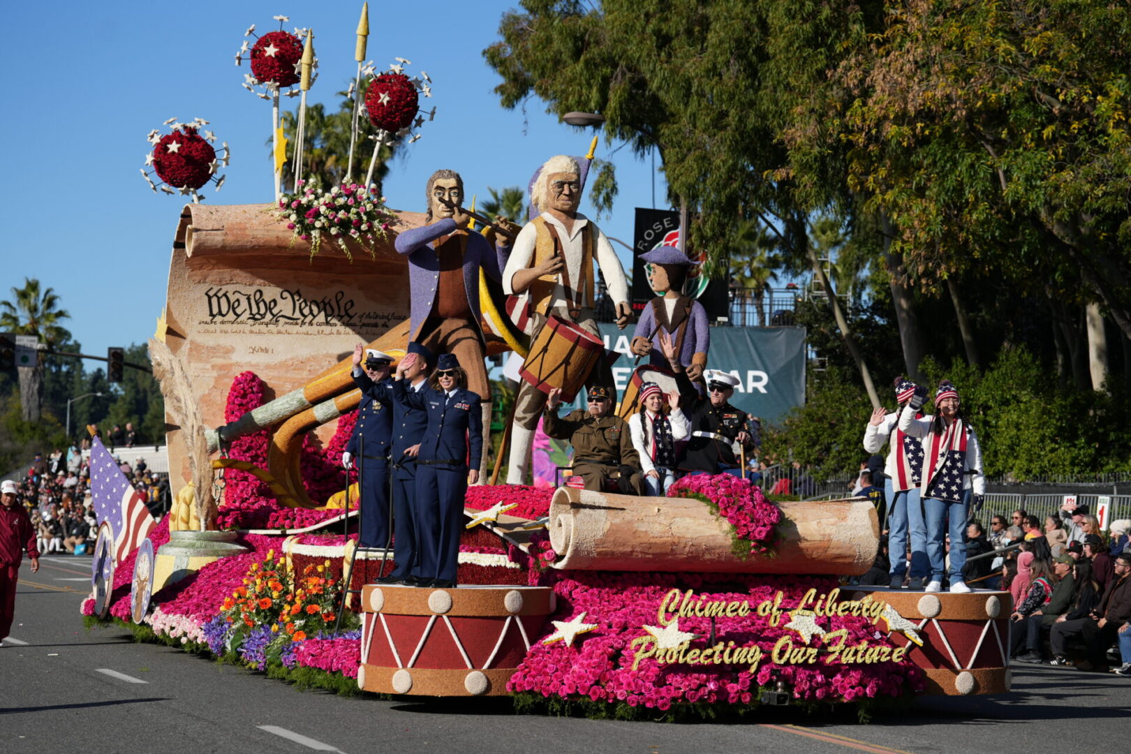 Parade float showing We the People scroll