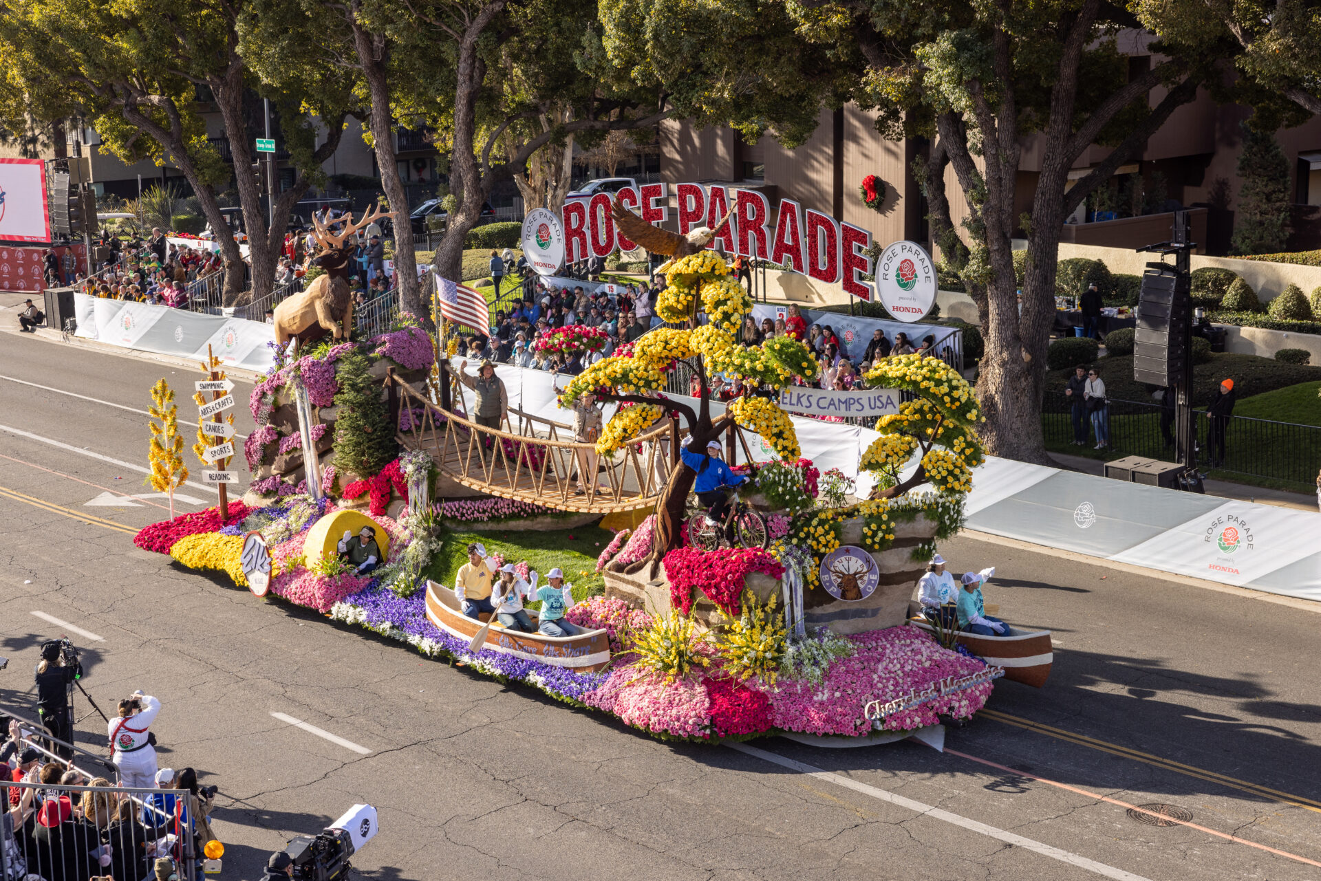 Colorful floral float in Rose Parade procession