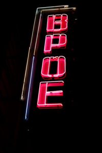 Vertical pink neon sign reading BPOE