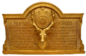 Ornate gold Elk's Creed plaque